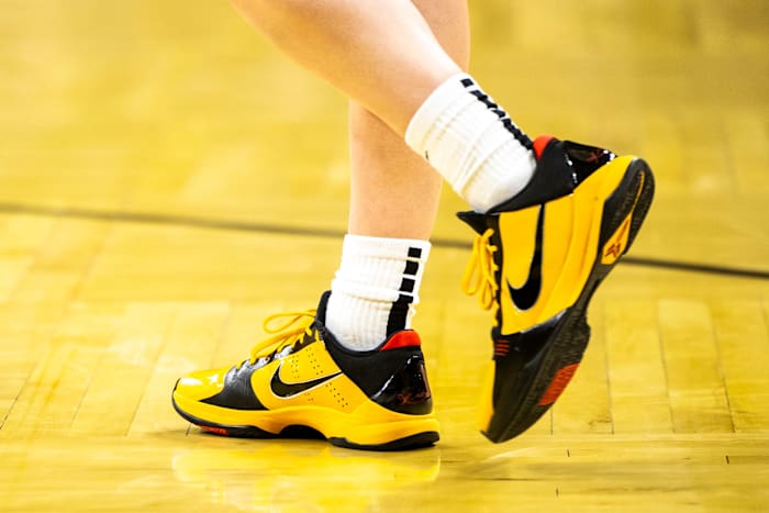 Iowa Hawkeyes guard Caitlin Clark's black and gold Nike Kobe sneakers.
